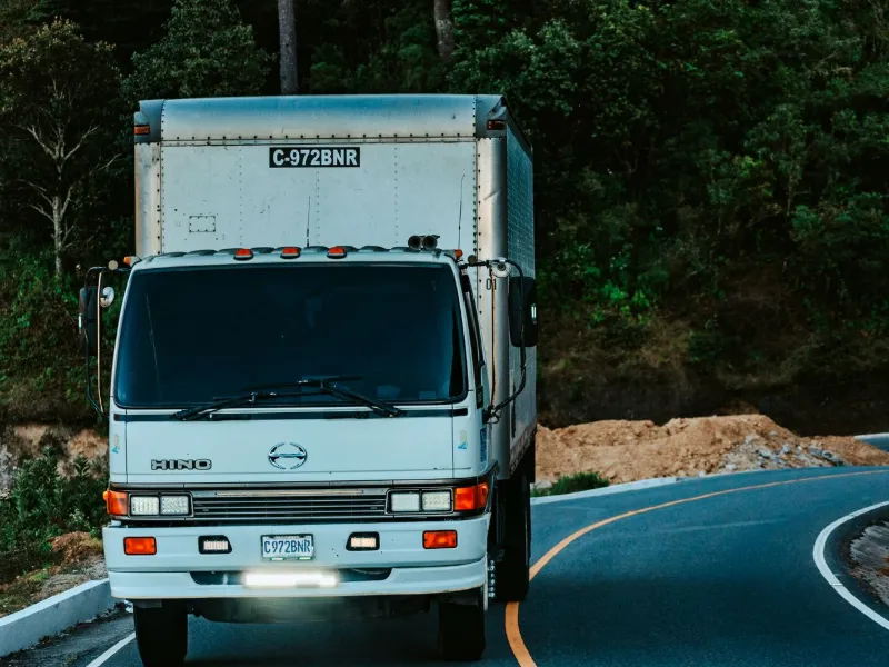 Closed moving truck used for safe two-wheeler transport from Kakinada