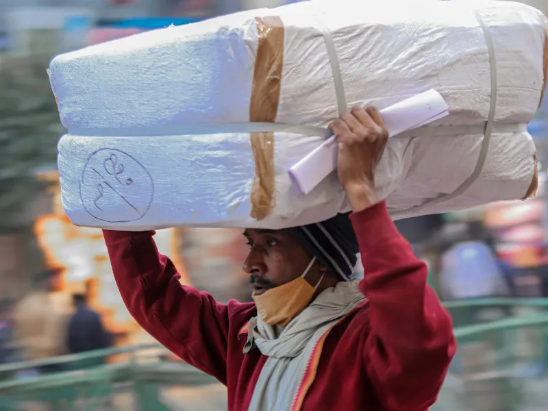 Mover carrying packed goods during an office shifting in Kakinada