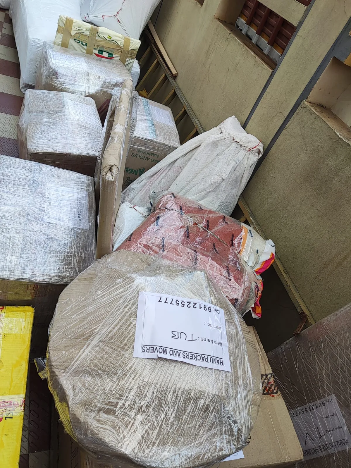 Fragile household items packed and labelled for safe shifting from Kakinada