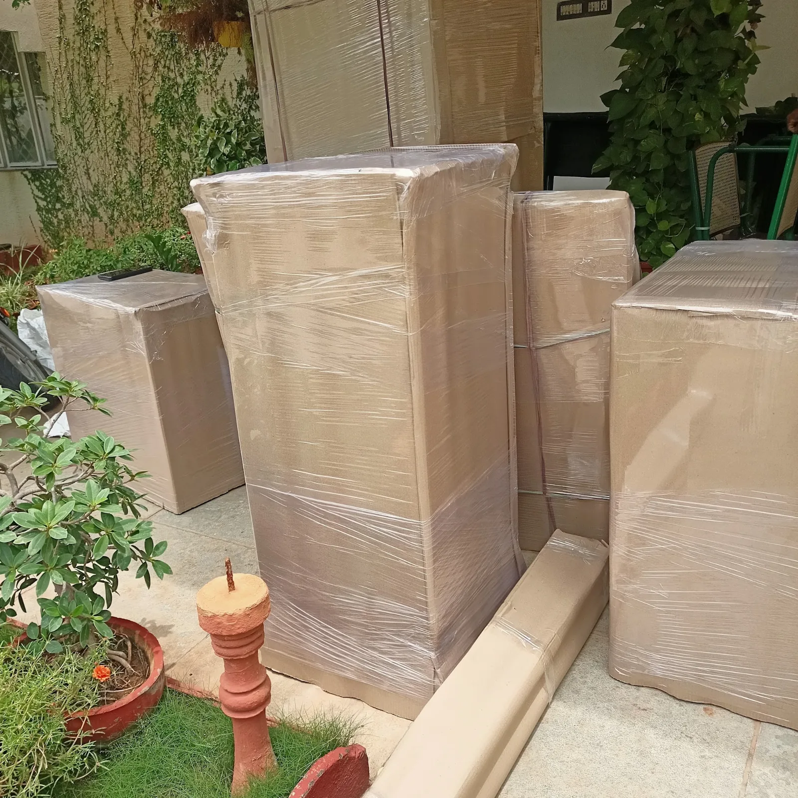 Furniture packed in cardboard and stretch film for house shifting in Rajahmundry