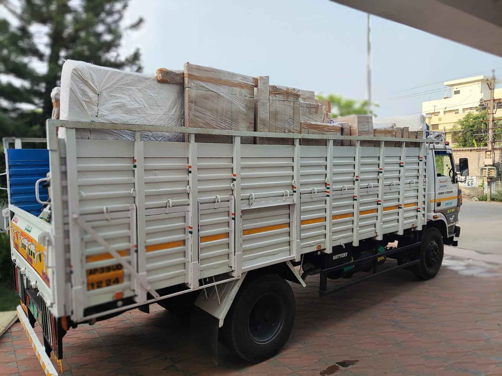 Hanu Packers and Movers truck loaded with packed household goods in Kakinada