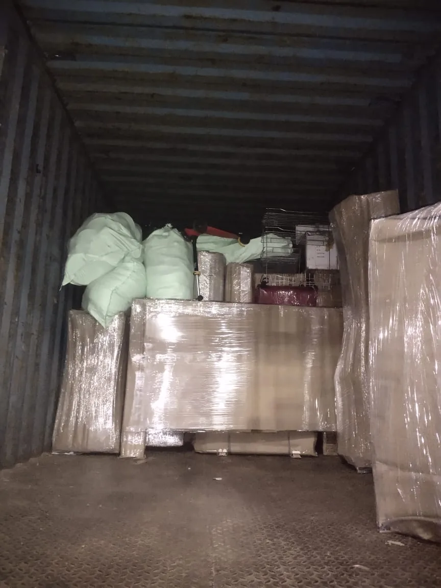 Household goods loaded in a closed container truck from Rajahmundry